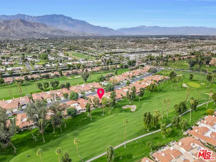a view of a city with mountains in the background
