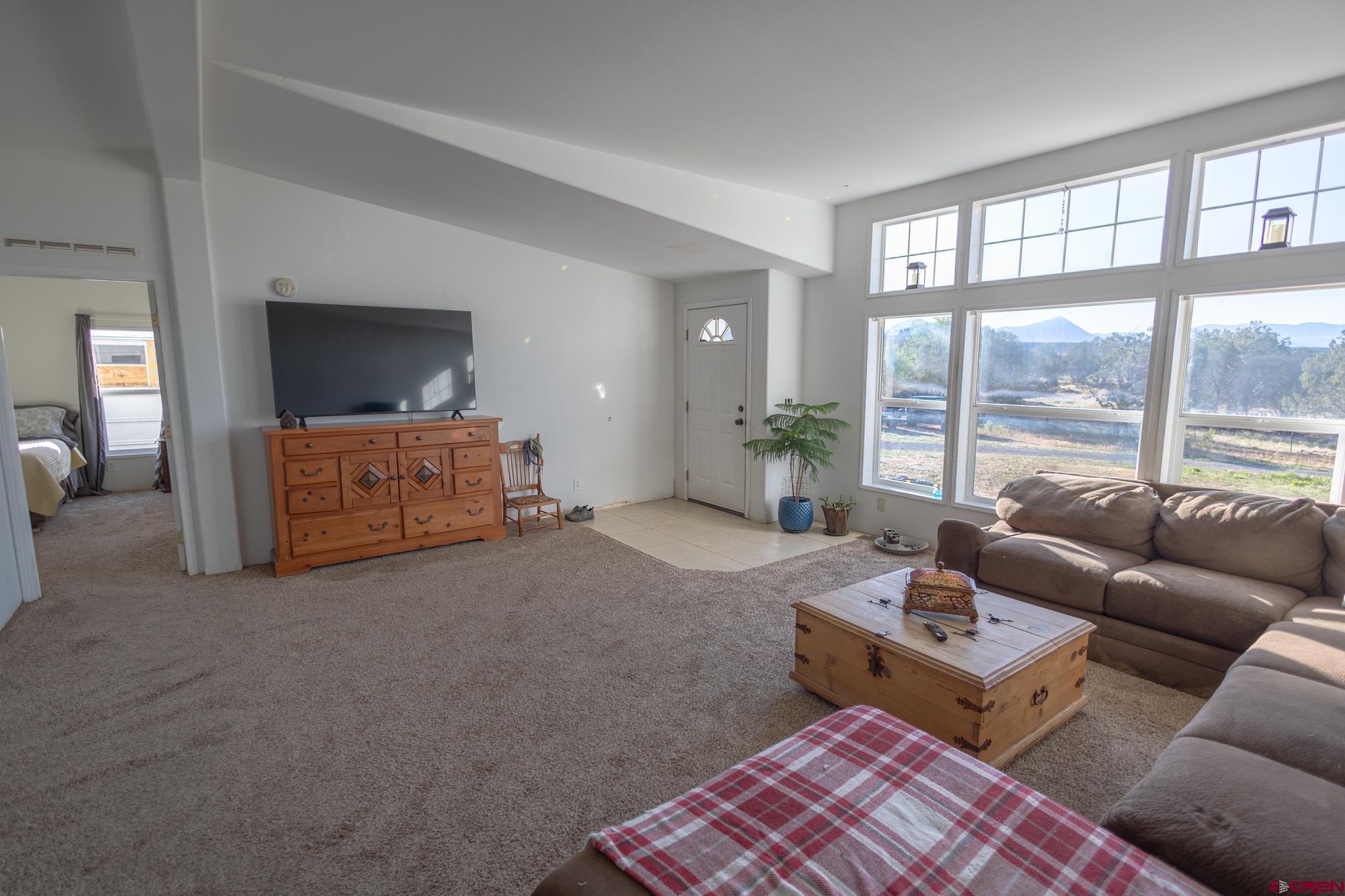 13569 3100th Road Hotchkiss, CO 81419 - Photo 11 of 31 a living room with furniture and a large window