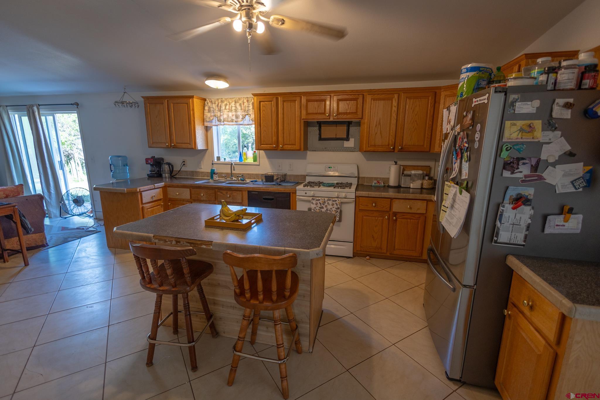 13569 3100th Road Hotchkiss, CO 81419 - Photo 15 of 31 a view of a dining room with furniture and a chandelier
