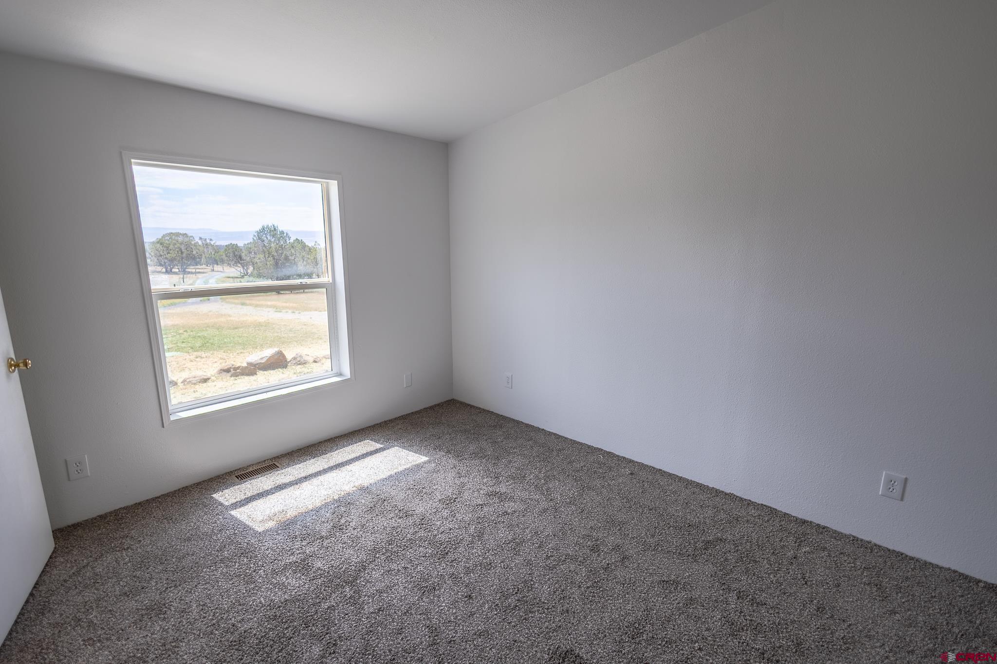13569 3100th Road Hotchkiss, CO 81419 - Photo 15 of 29 an empty room with a window