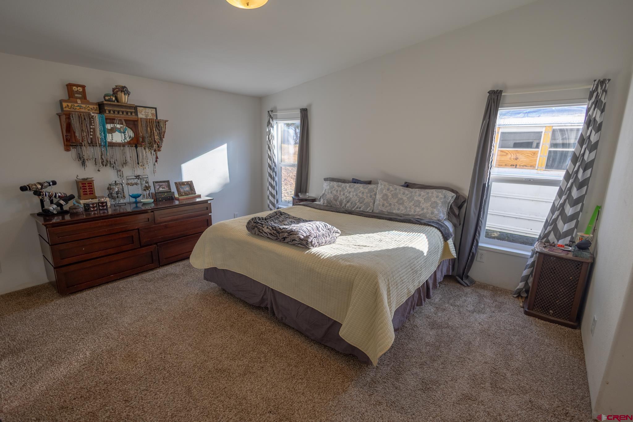 13569 3100th Road Hotchkiss, CO 81419 - Photo 20 of 31 a bedroom with a bed and window