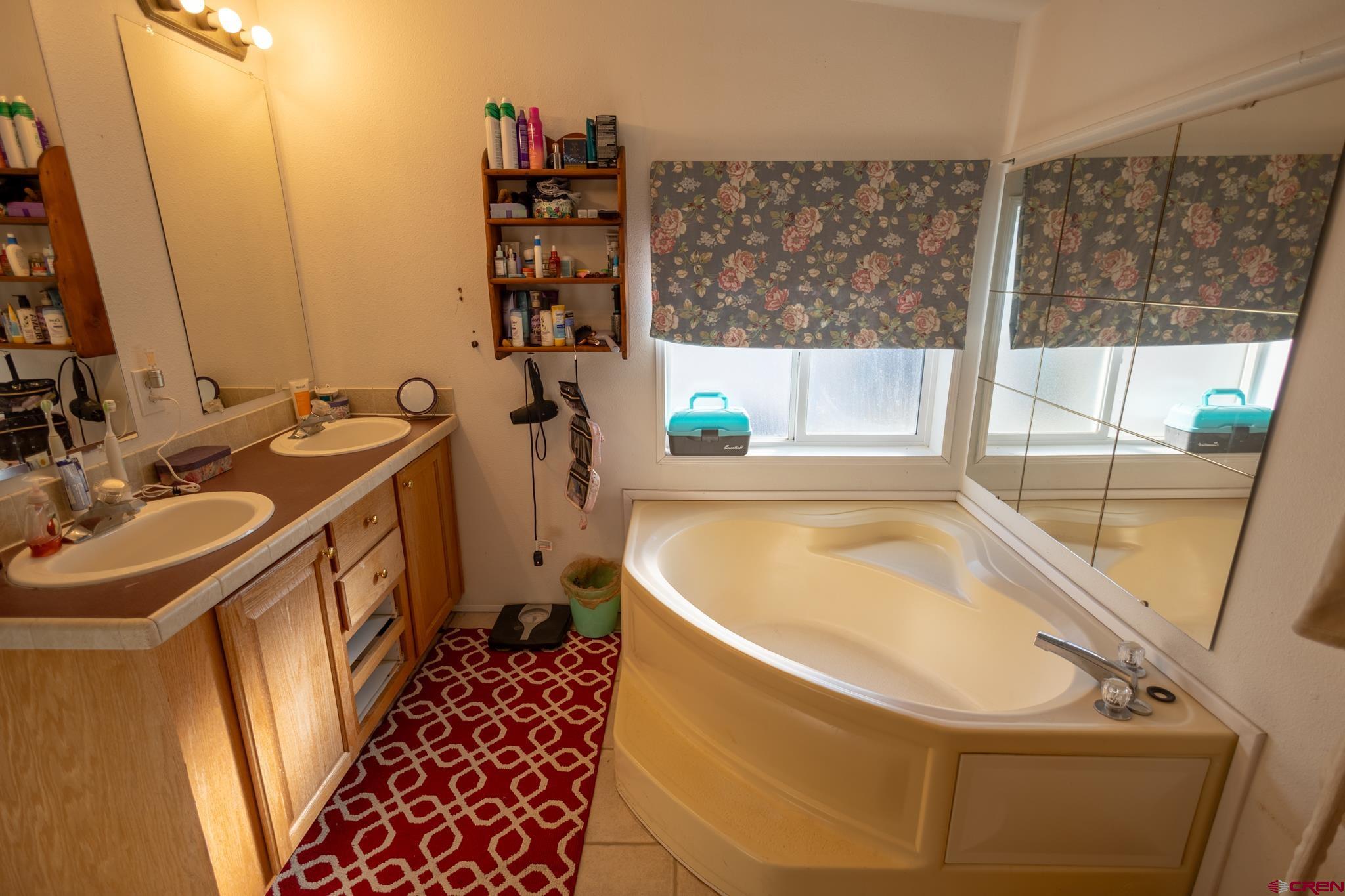 13569 3100th Road Hotchkiss, CO 81419 - Photo 22 of 31 a bathroom with a sink and a bathtub