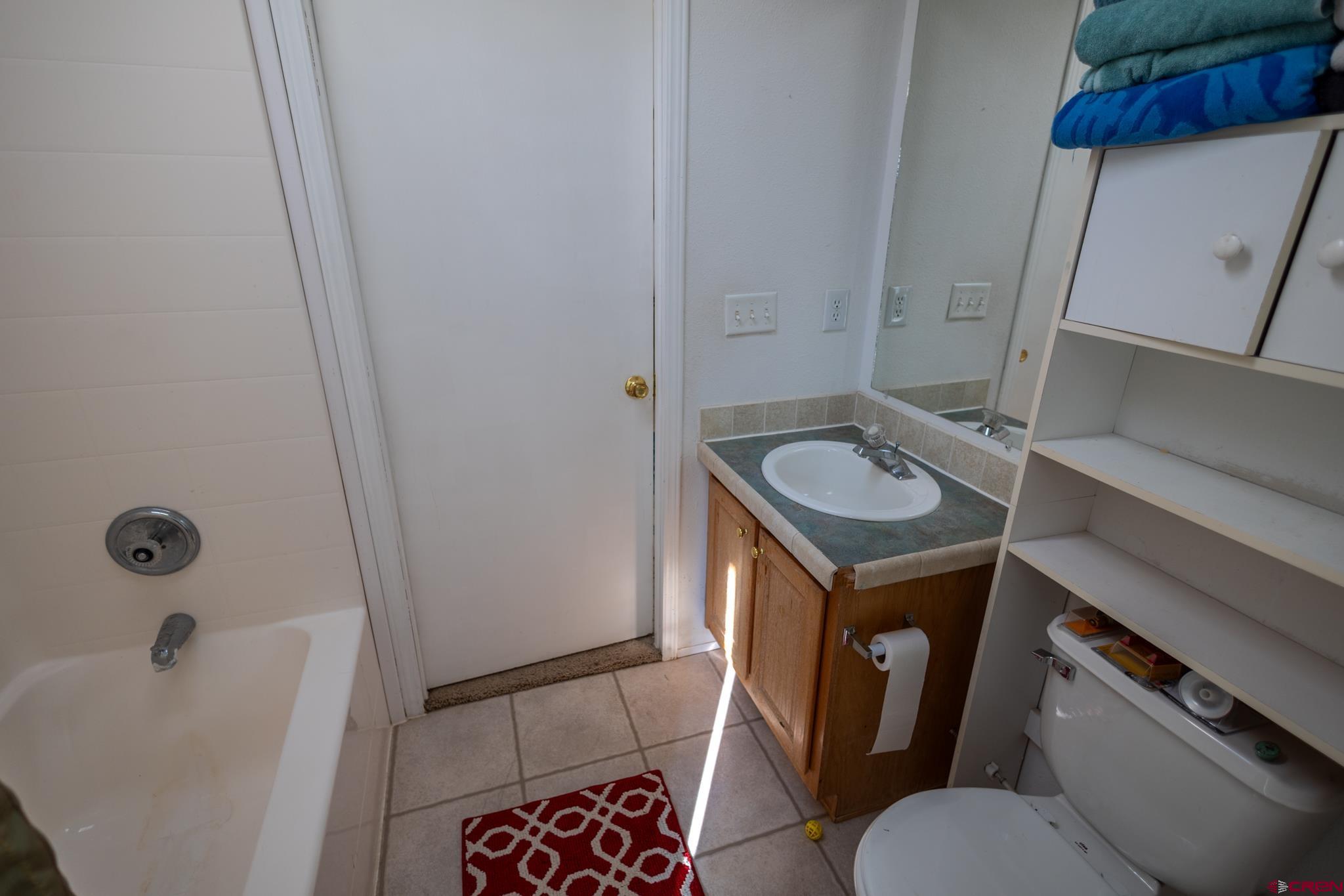 13569 3100th Road Hotchkiss, CO 81419 - Photo 25 of 31 a bathroom with a toilet and a sink