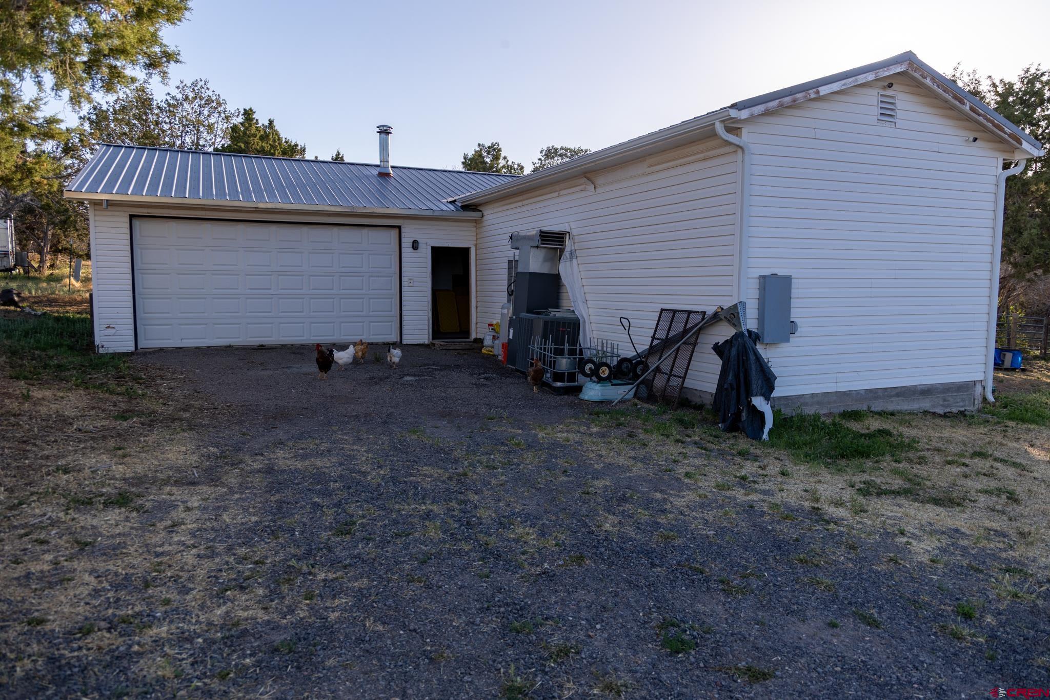 13569 3100th Road Hotchkiss, CO 81419 - Photo 27 of 31 a view of house with backyard and entertaining space