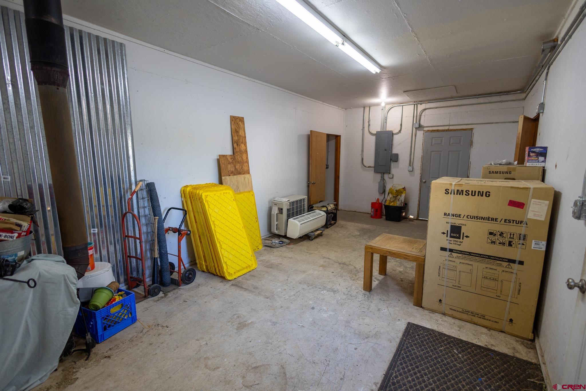 13569 3100th Road Hotchkiss, CO 81419 - Photo 29 of 31 a bedroom with a bed and a mirror