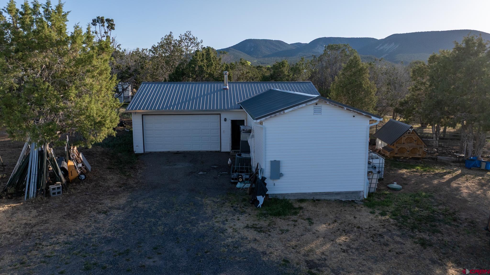 13569 3100th Road Hotchkiss, CO 81419 - Photo 10 of 31 a view of a barn in the middle of a yard