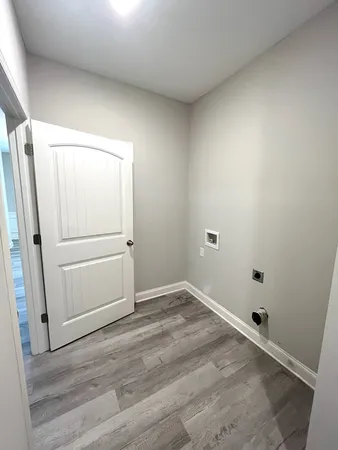 an empty room with wooden floor