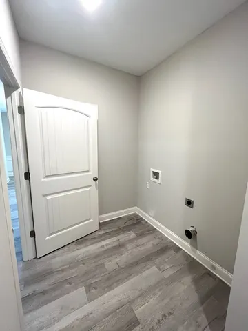 an empty room with wooden floor