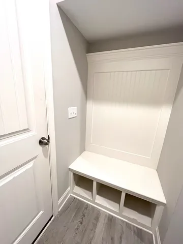 a view of room with window and hardwood floor