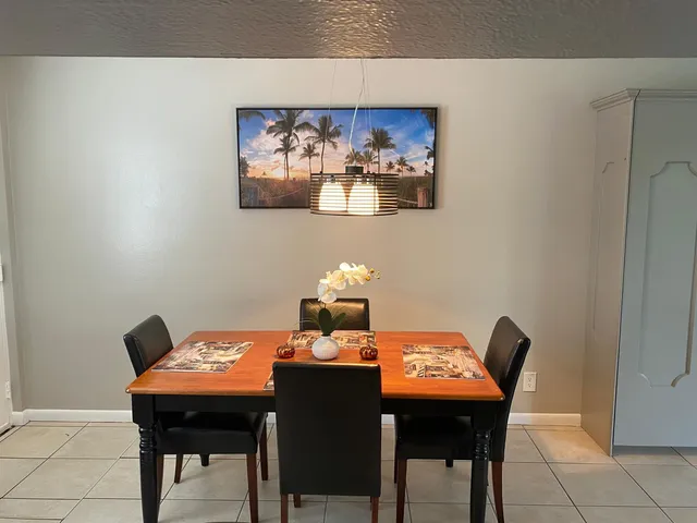 a room with a table and chairs