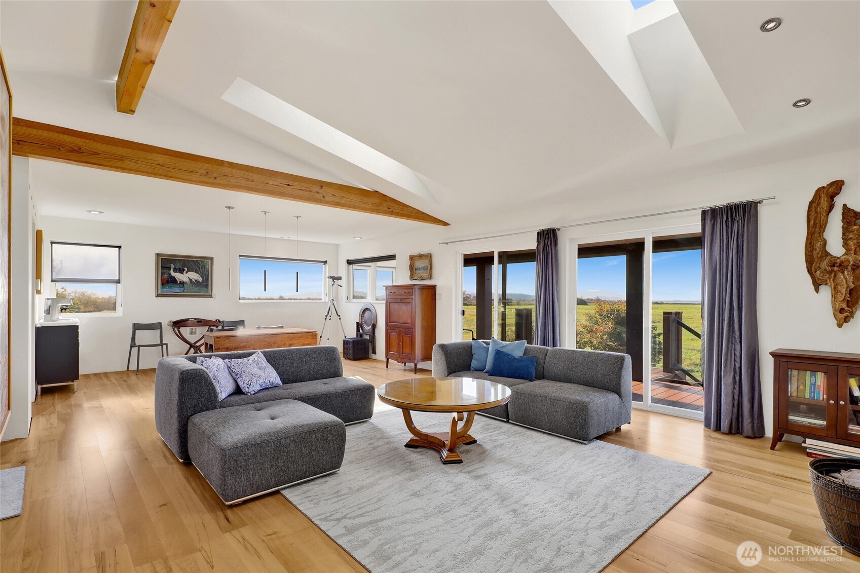 5544 Smith Road Bow, WA 98232 - Photo 19 of 40 a living room with furniture and a fireplace