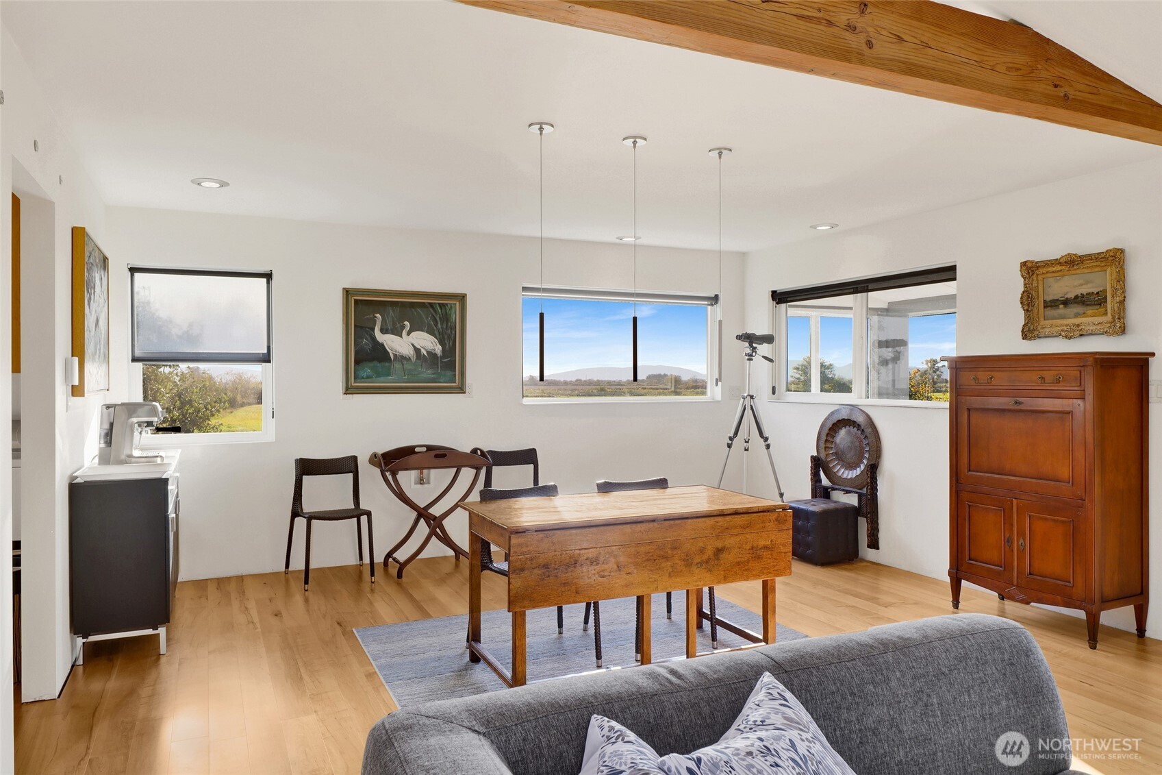 5544 Smith Road Bow, WA 98232 - Photo 21 of 40 a living room with furniture a flat screen tv and kitchen view