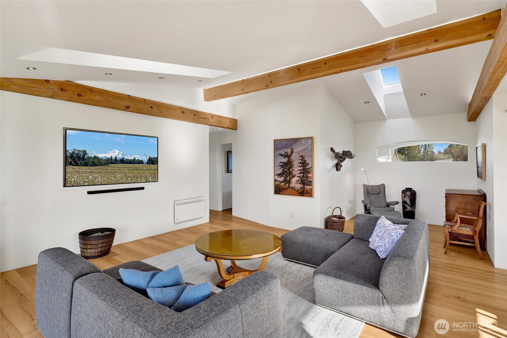 5544 Smith Road Bow, WA 98232 - Photo 23 of 40 a living room with furniture and a flat screen tv