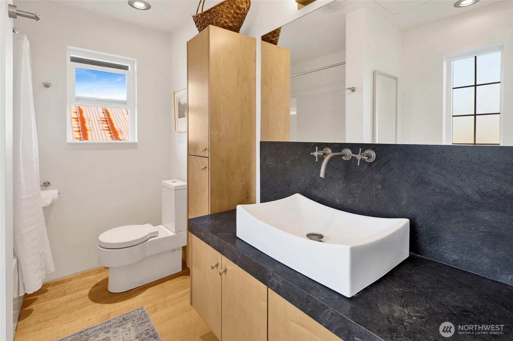 5544 Smith Road Bow, WA 98232 - Photo 26 of 40 a bathroom with a sink a toilet and shower