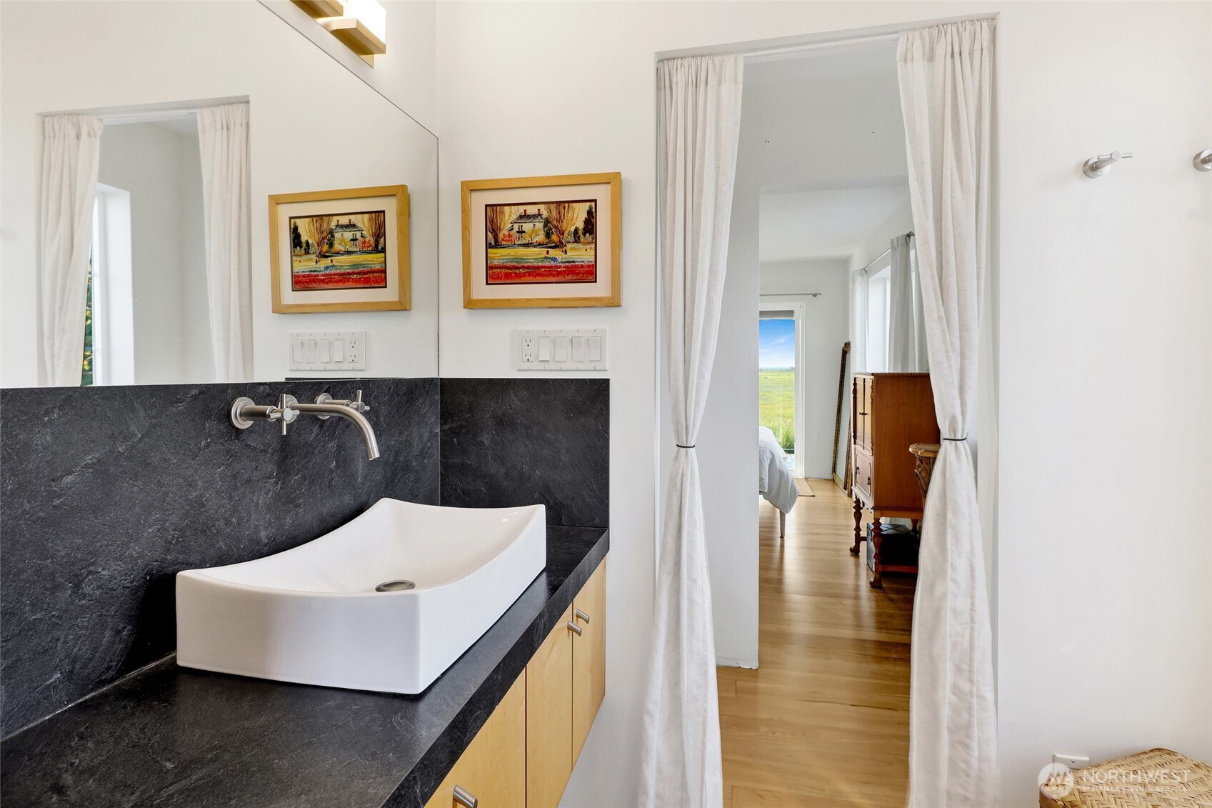 5544 Smith Road Bow, WA 98232 - Photo 27 of 40 a bathroom with a sink and a mirror