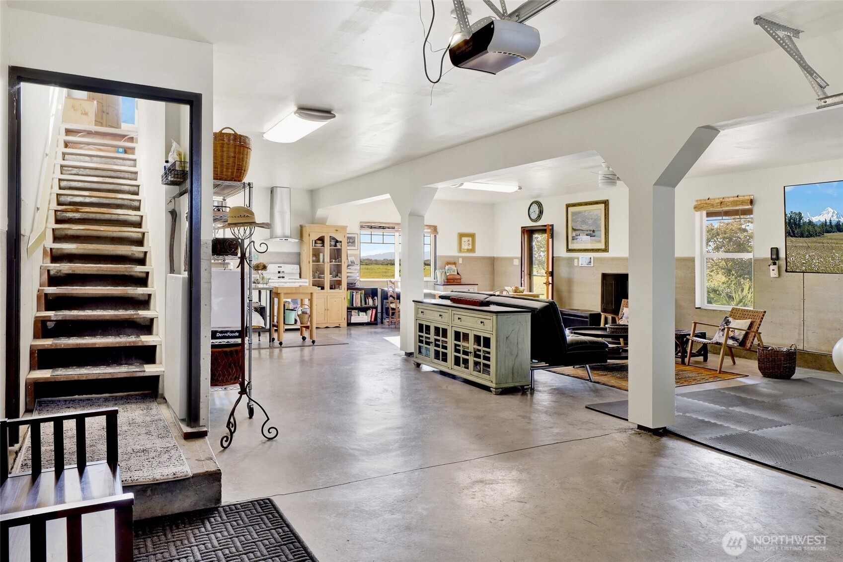 5544 Smith Road Bow, WA 98232 - Photo 31 of 40 a living room with furniture and a book shelf