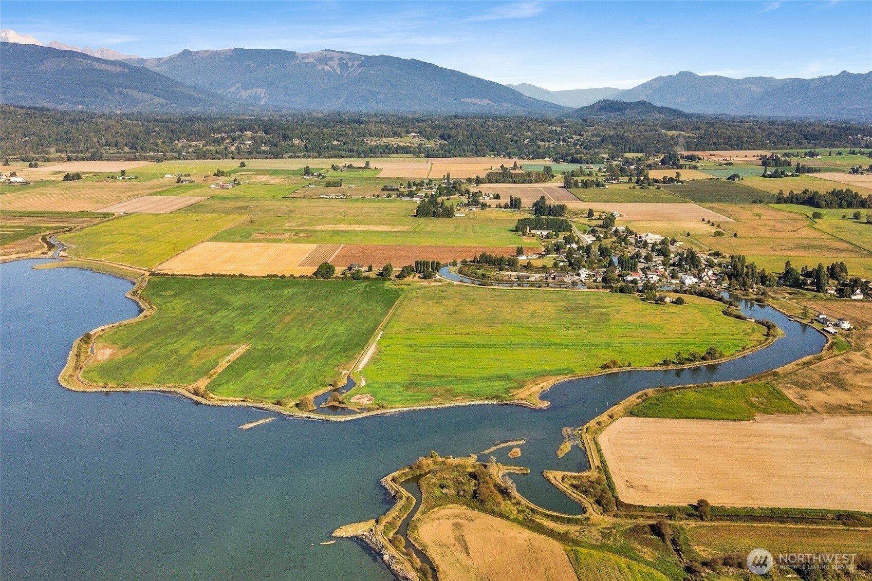 5544 Smith Road Bow, WA 98232 - Photo 5 of 40 a view of a lake with a mountain