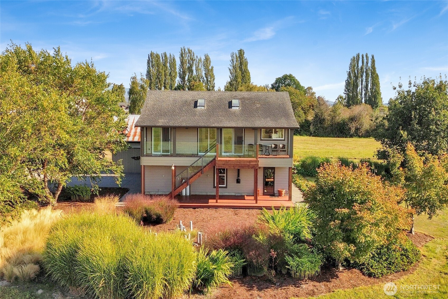 5544 Smith Road Bow, WA 98232 - Photo 9 of 40 a view of a house with a yard and sitting area