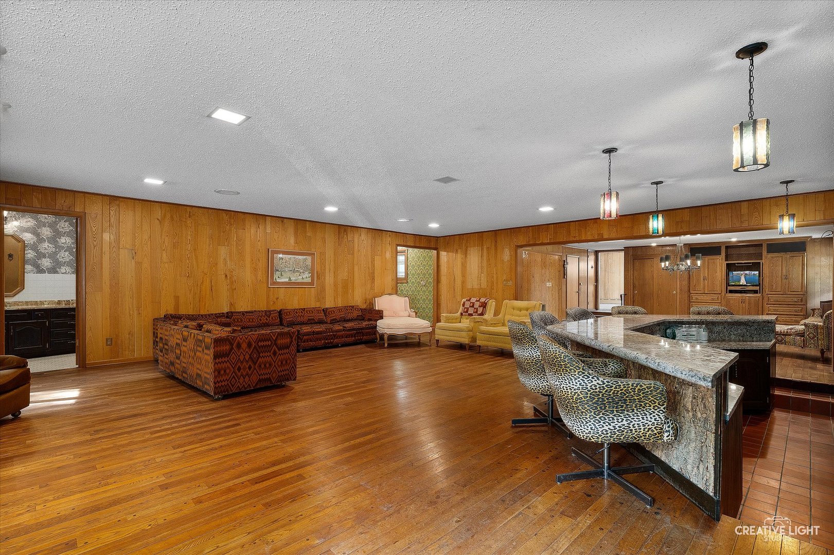 16323 Griswold Springs Road Plano, IL 60545 - Photo 6 of 55 a living room with furniture and a wooden floor