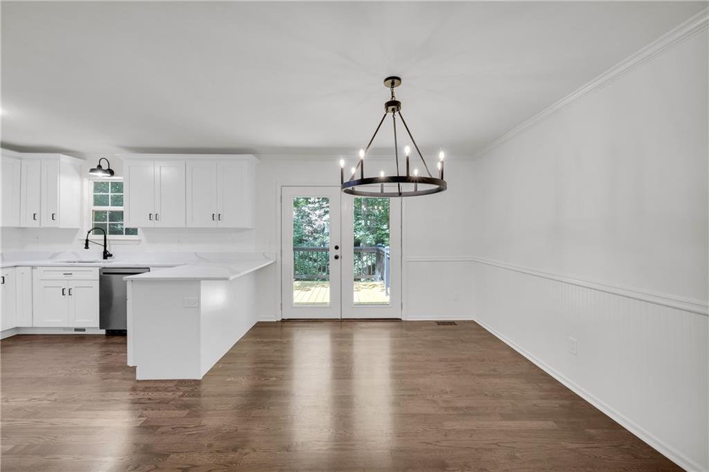 2941 Lake Hollow Road Gainesville, GA 30501 - Photo 11 of 53 a view of a kitchen with a sink wooden floor and a window