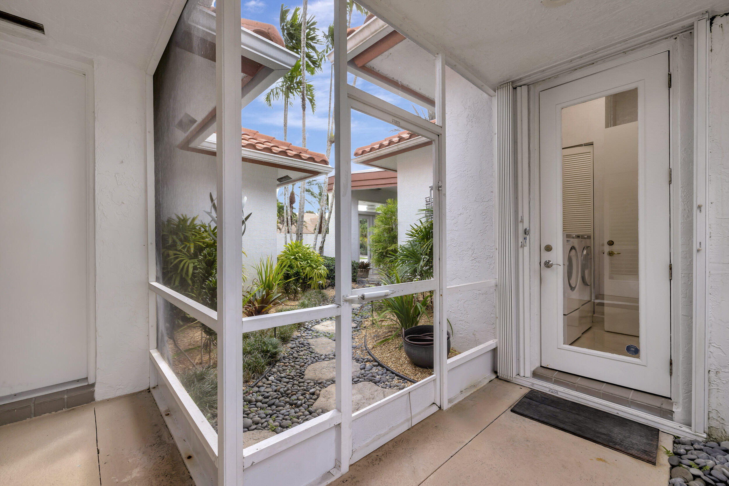 10598 Stonebridge Boulevard Boca Raton, FL 33498 - Photo 35 of 68 Walkway to Private Entrance