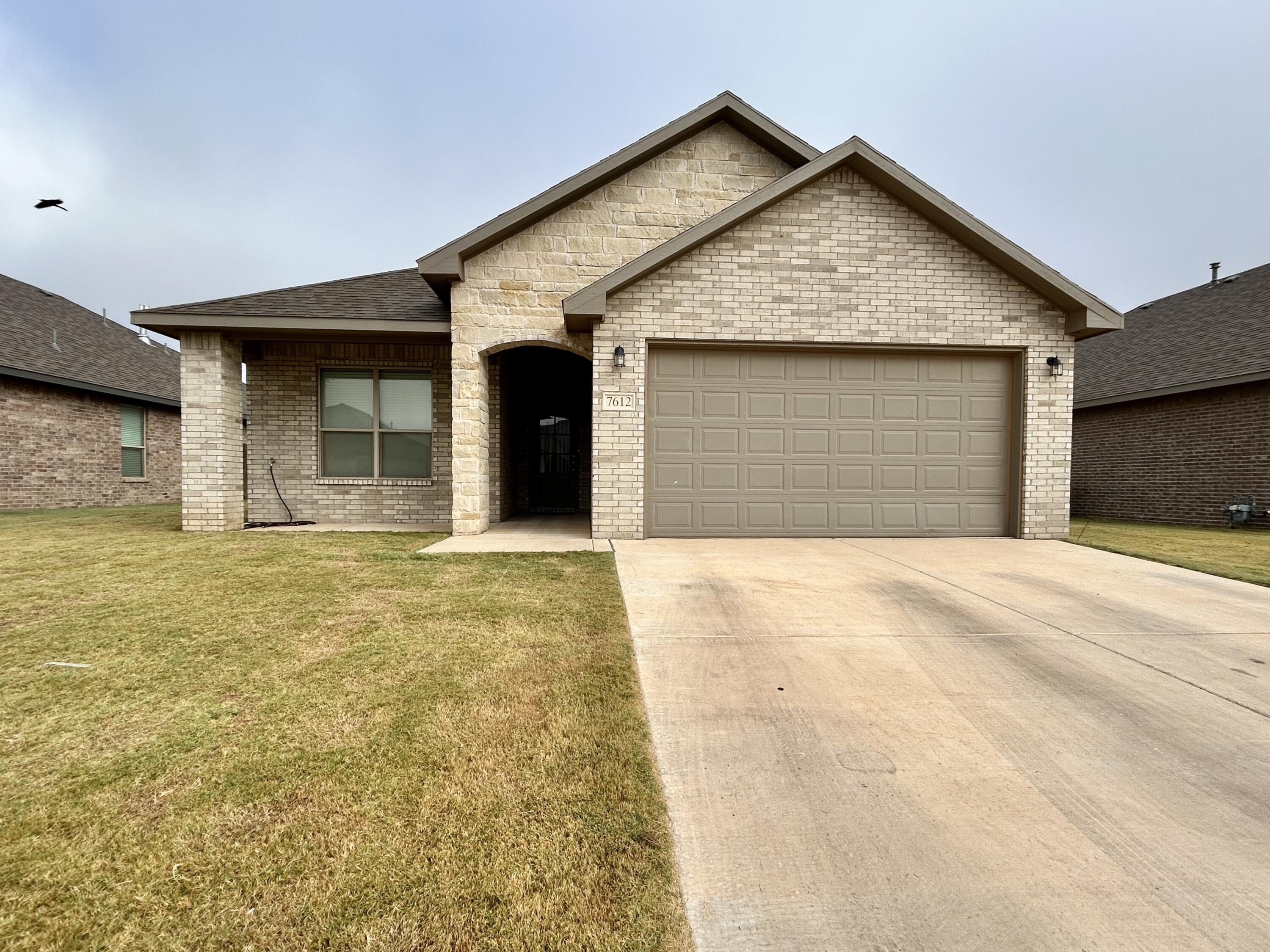 7612 61st Street Lubbock, TX 79407 - Photo 1 of 15 a view of yellow house with large outdoor space