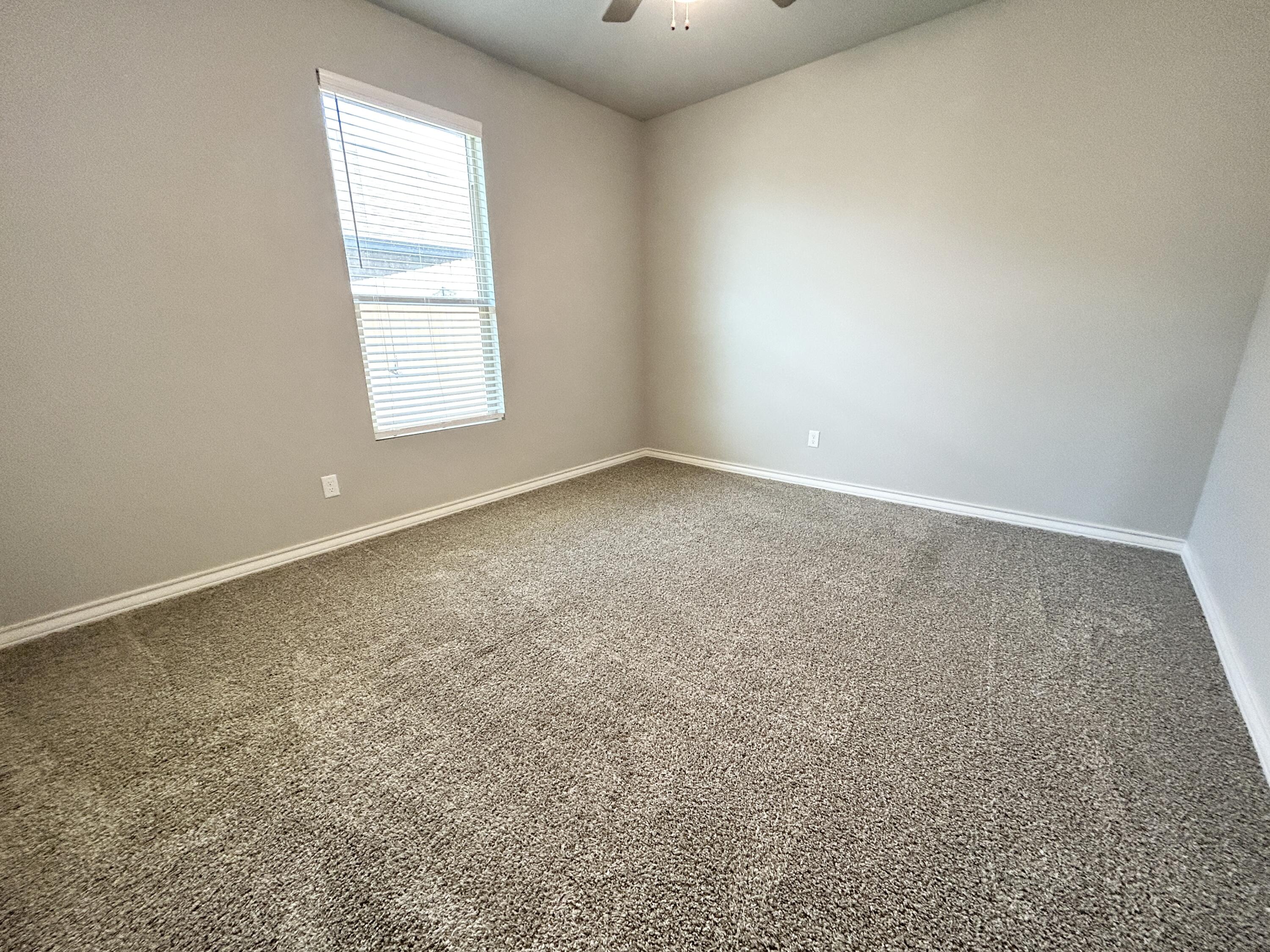 7612 61st Street Lubbock, TX 79407 - Photo 11 of 15 an empty room with windows