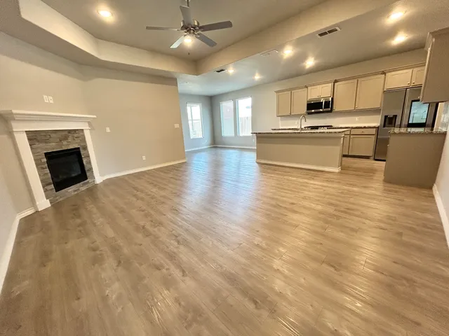 a view of kitchen with cabinets and wooden floor
