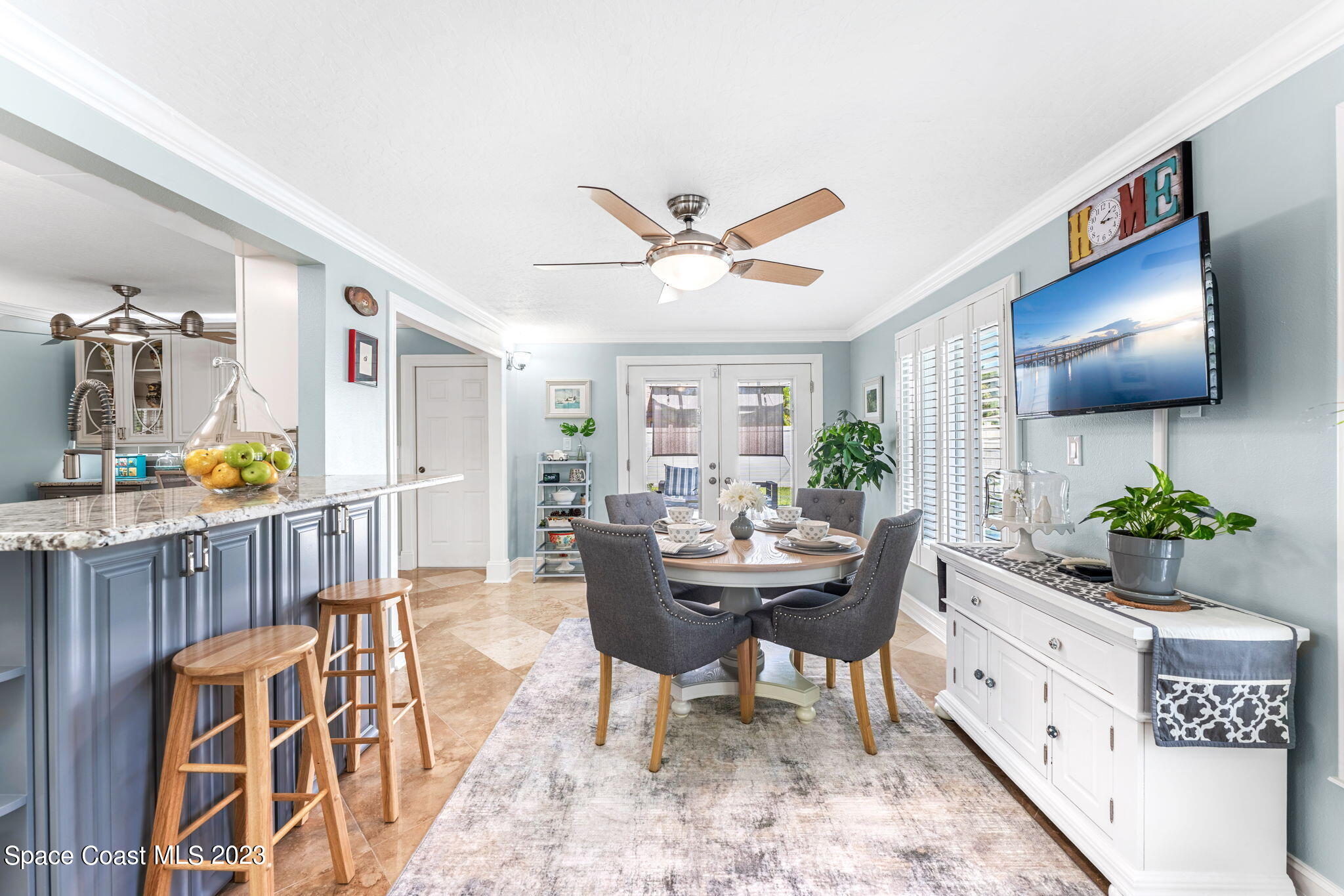 445 9th Avenue Indialantic, FL 32903 - Photo 16 of 62 a living room with furniture a chandelier and a wooden floor