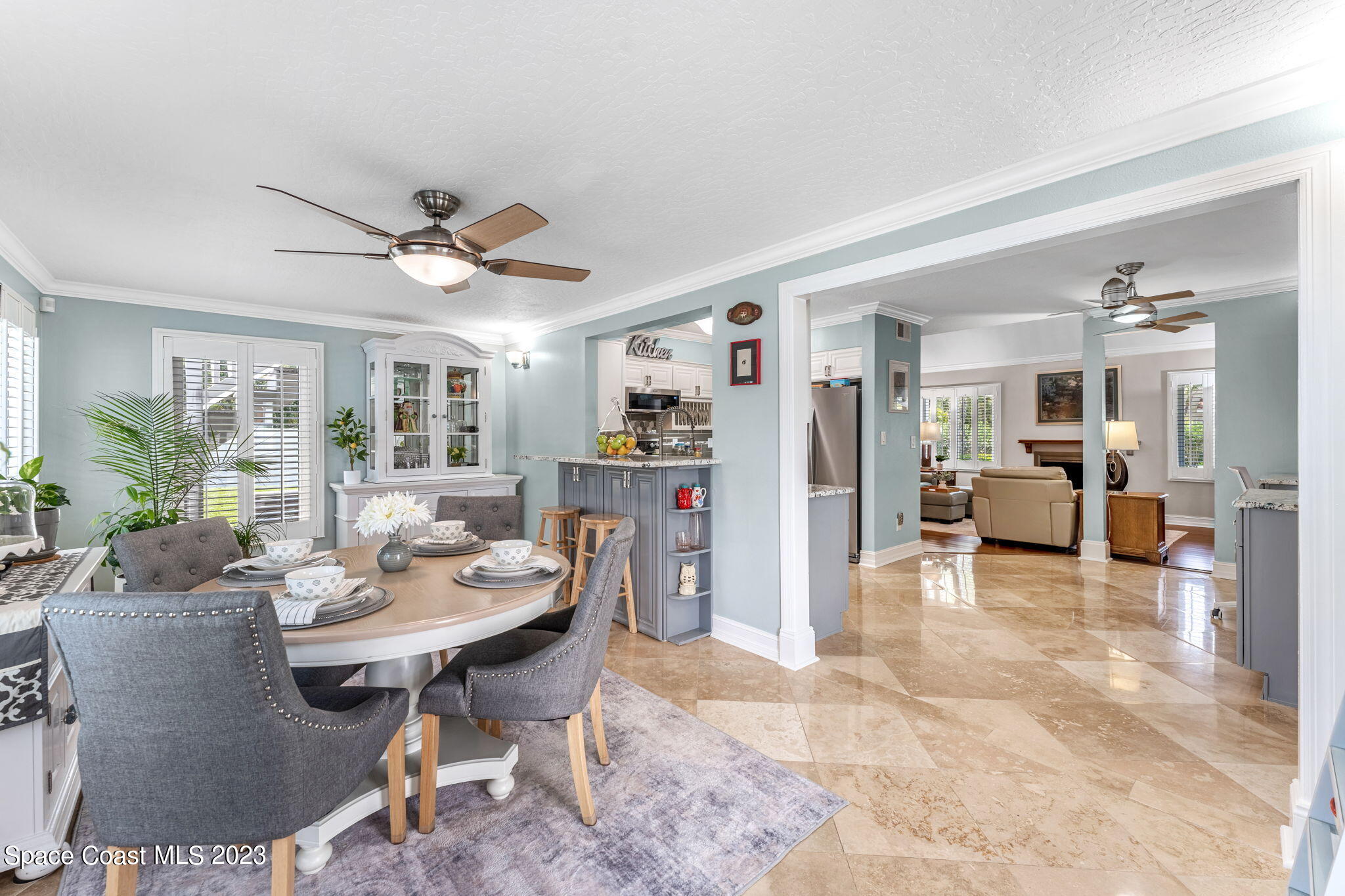 445 9th Avenue Indialantic, FL 32903 - Photo 17 of 62 a living room with furniture a flat screen tv and a large window
