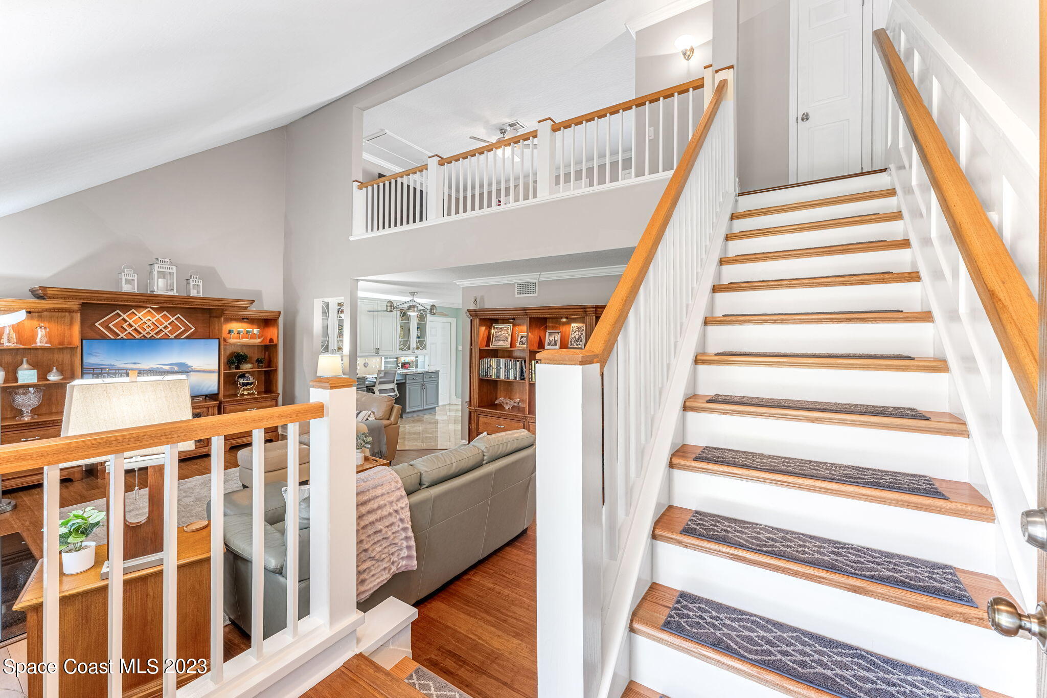 445 9th Avenue Indialantic, FL 32903 - Photo 23 of 62 a view of entryway with wooden floor and windows