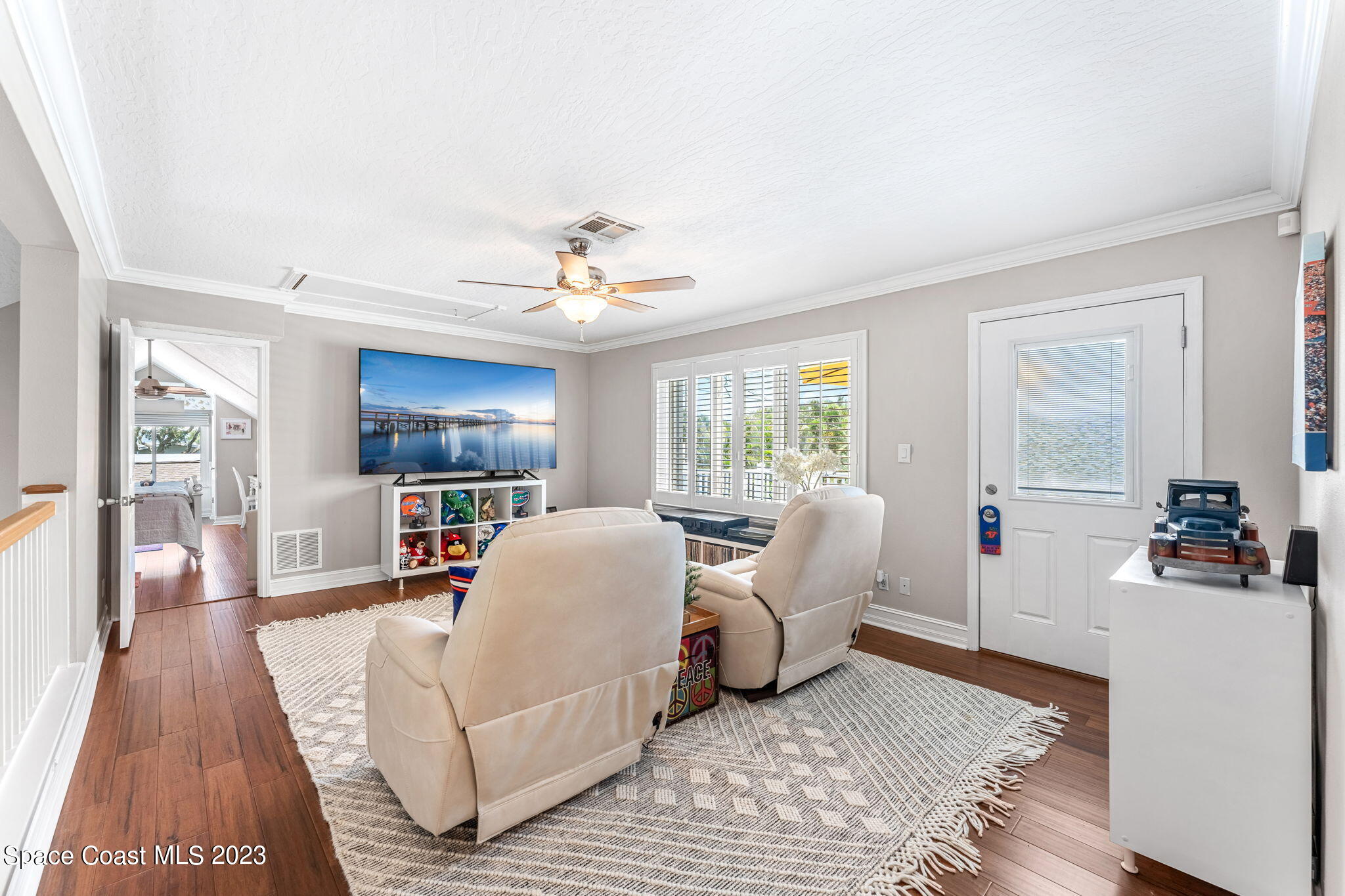 445 9th Avenue Indialantic, FL 32903 - Photo 27 of 62 a living room with furniture and a wooden floor