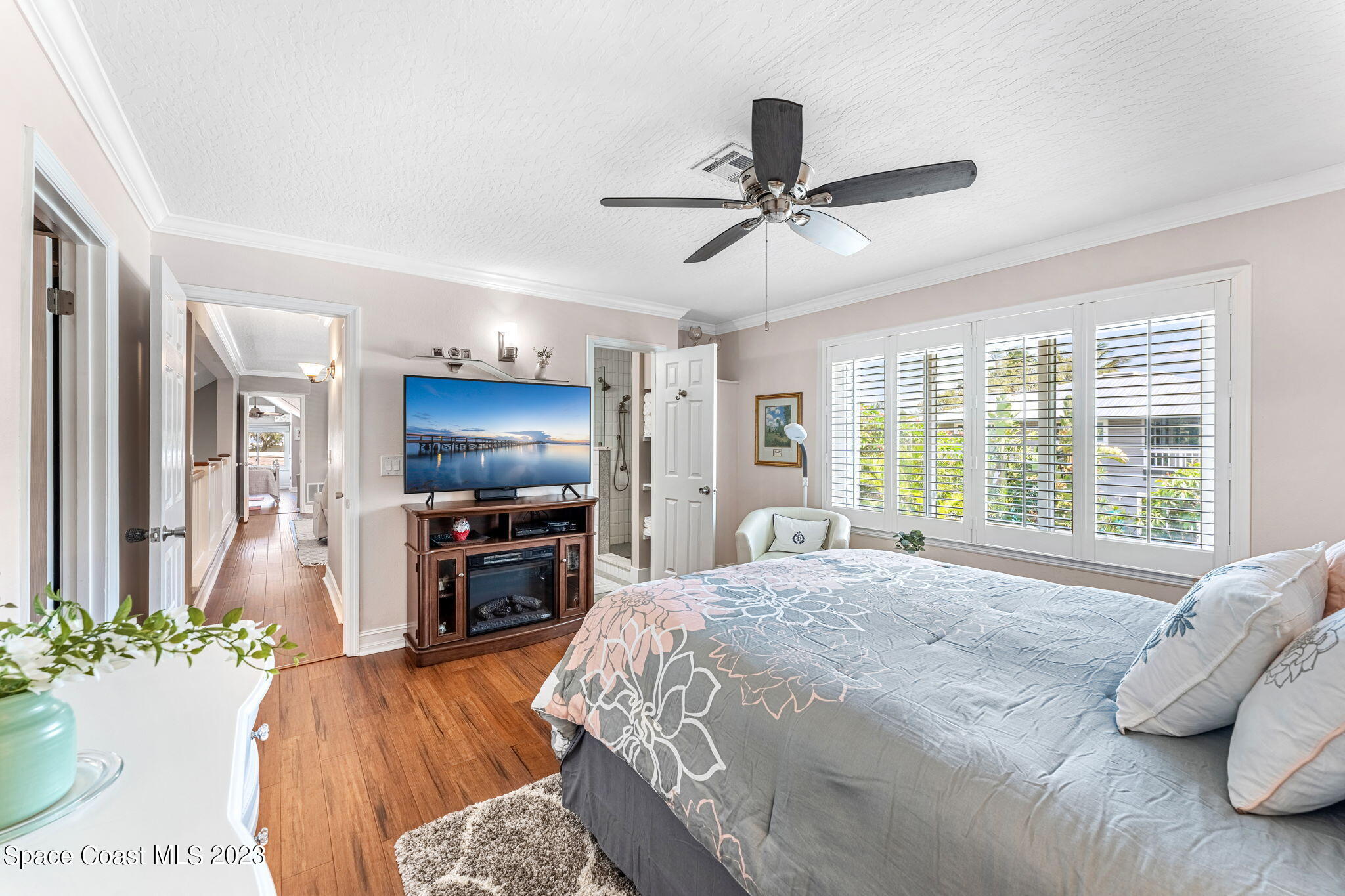 445 9th Avenue Indialantic, FL 32903 - Photo 28 of 62 a bedroom with a bed and a flat screen tv