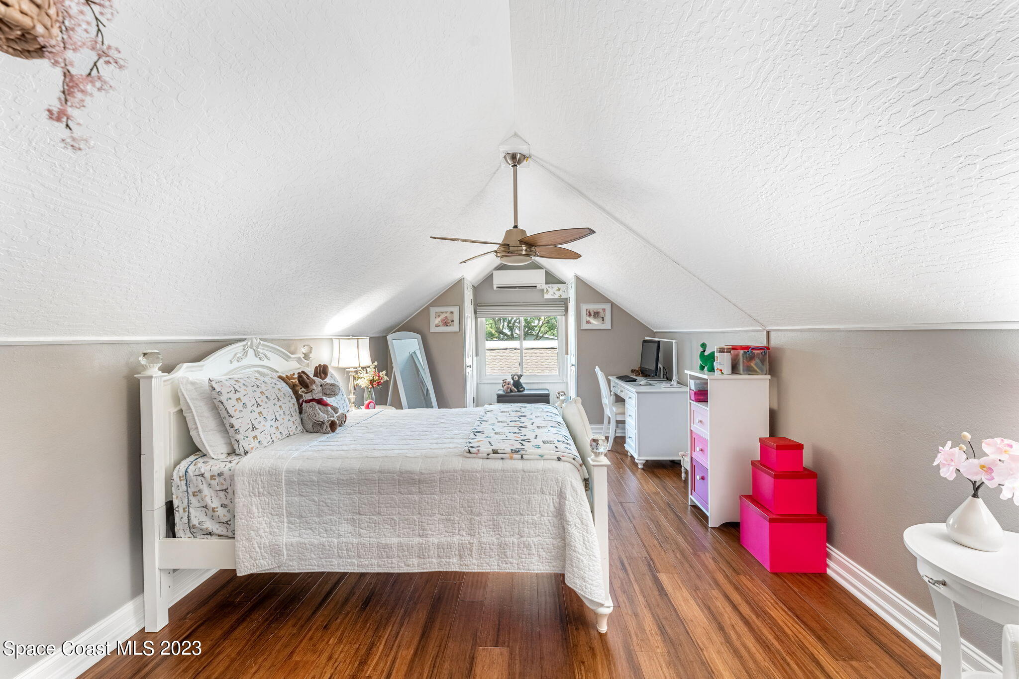 445 9th Avenue Indialantic, FL 32903 - Photo 34 of 62 a bedroom with a bed and wooden floor