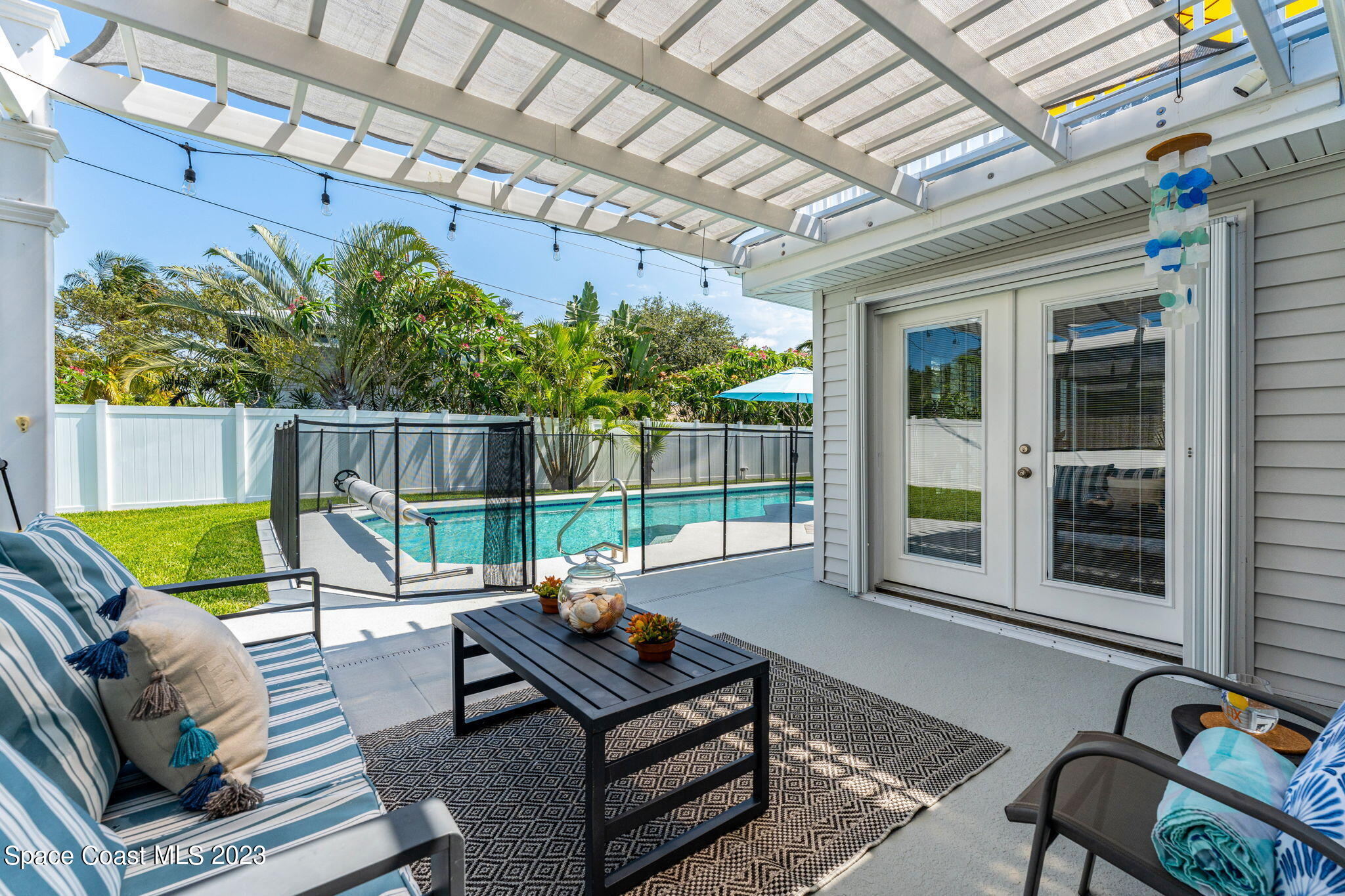 445 9th Avenue Indialantic, FL 32903 - Photo 37 of 62 a house view with a sitting space and garden