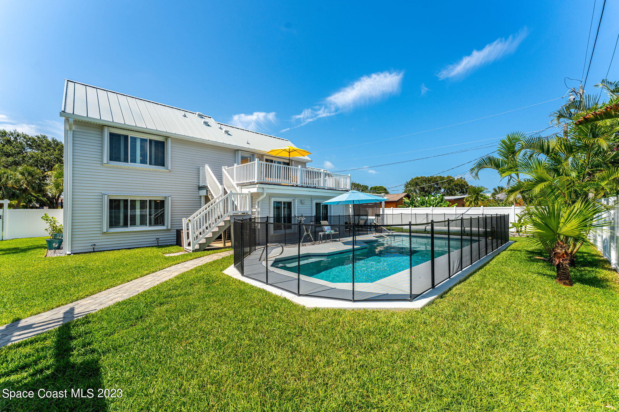 445 9th Avenue Indialantic, FL 32903 - Photo 43 of 62 a view of a house with backyard and sitting area