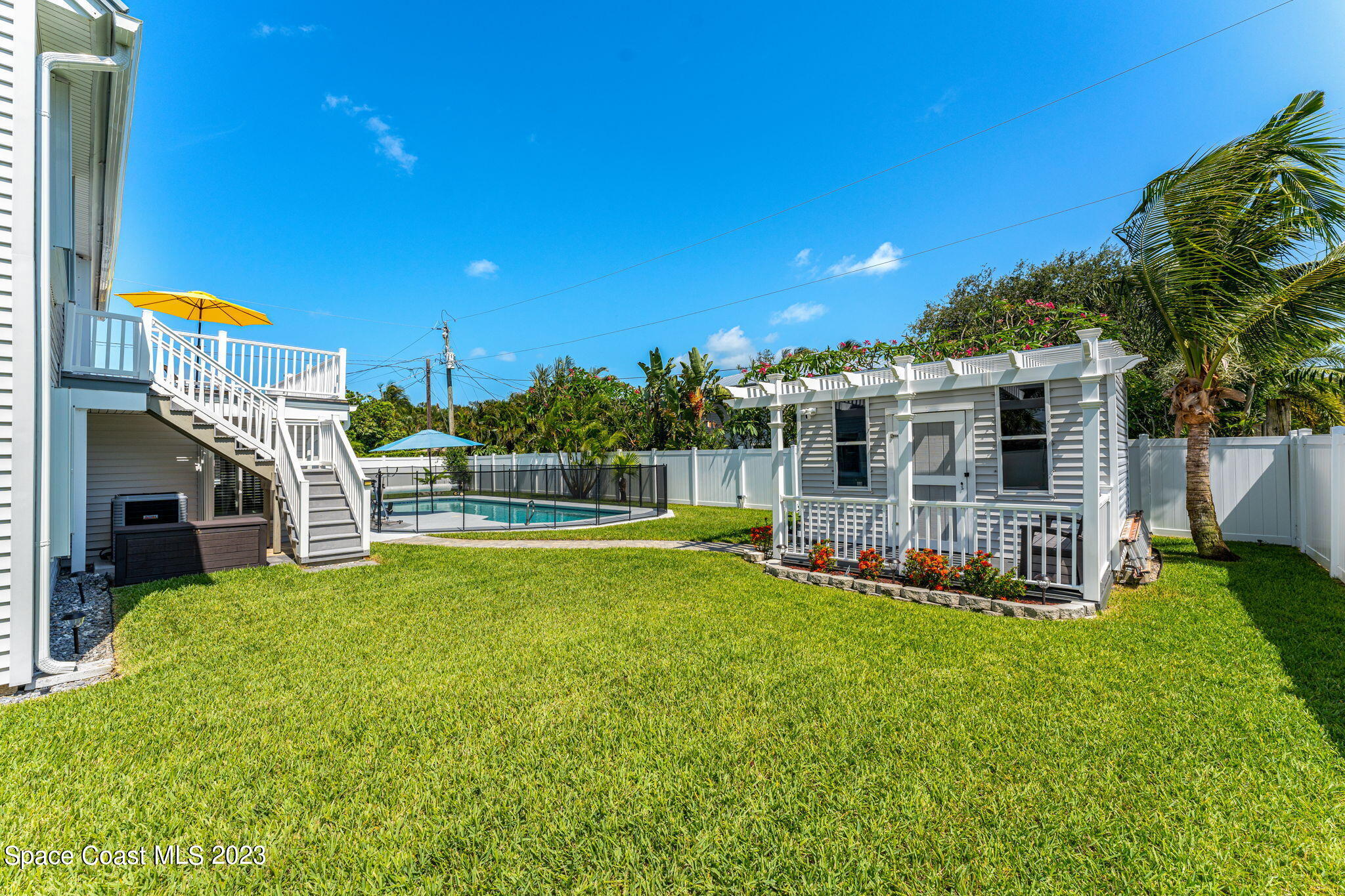 445 9th Avenue Indialantic, FL 32903 - Photo 44 of 62 a view of a house with a backyard porch and sitting area