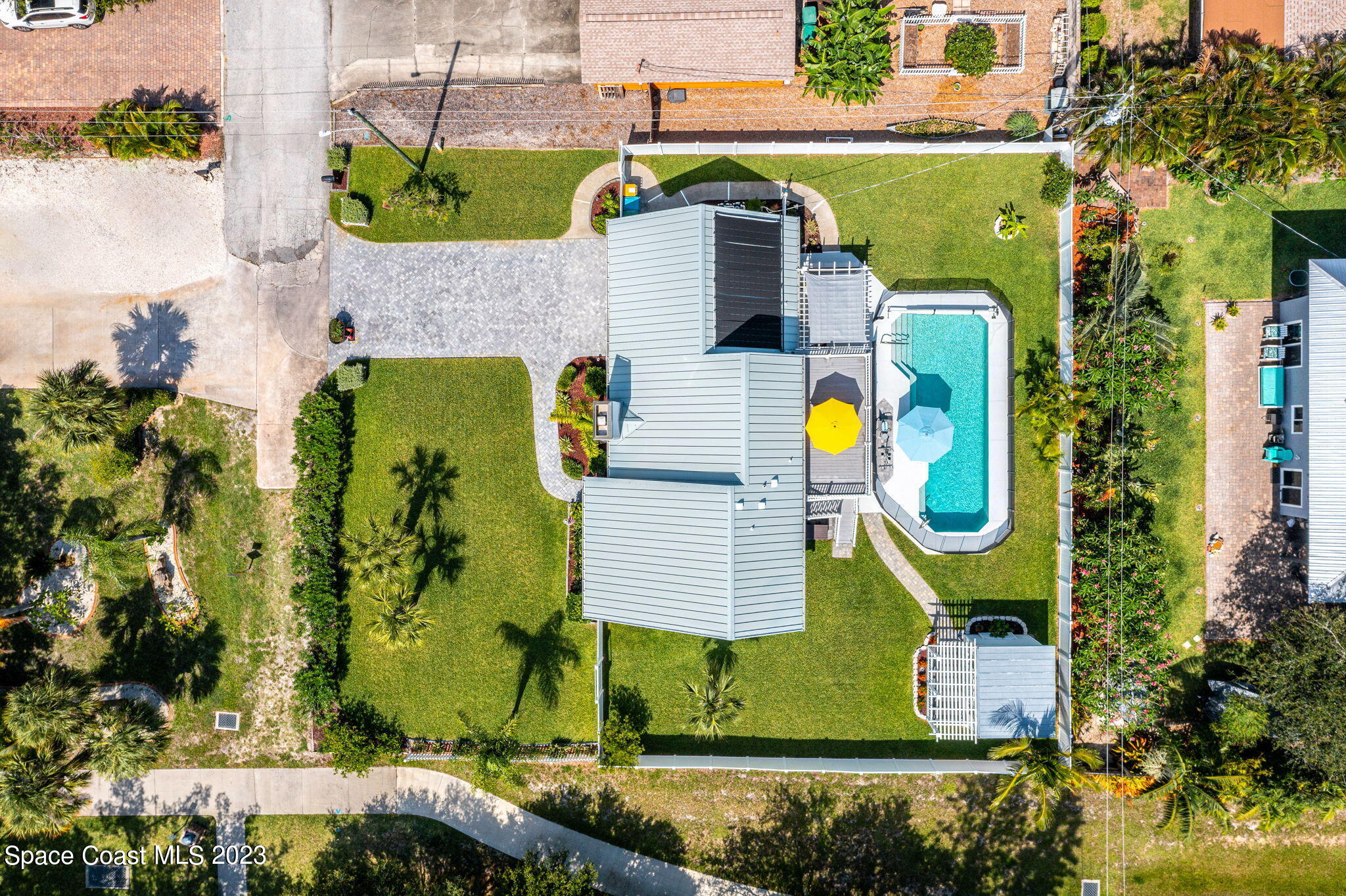 445 9th Avenue Indialantic, FL 32903 - Photo 4 of 62 an aerial view of a house with swimming pool