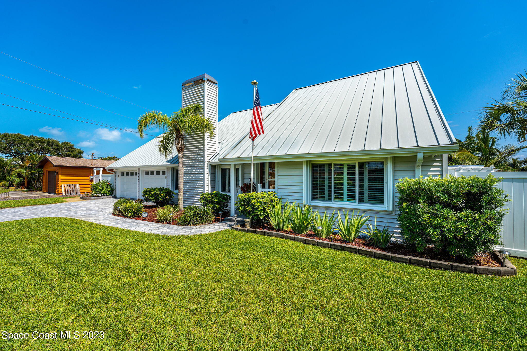 445 9th Avenue Indialantic, FL 32903 - Photo 51 of 62 a front view of house with yard and green space