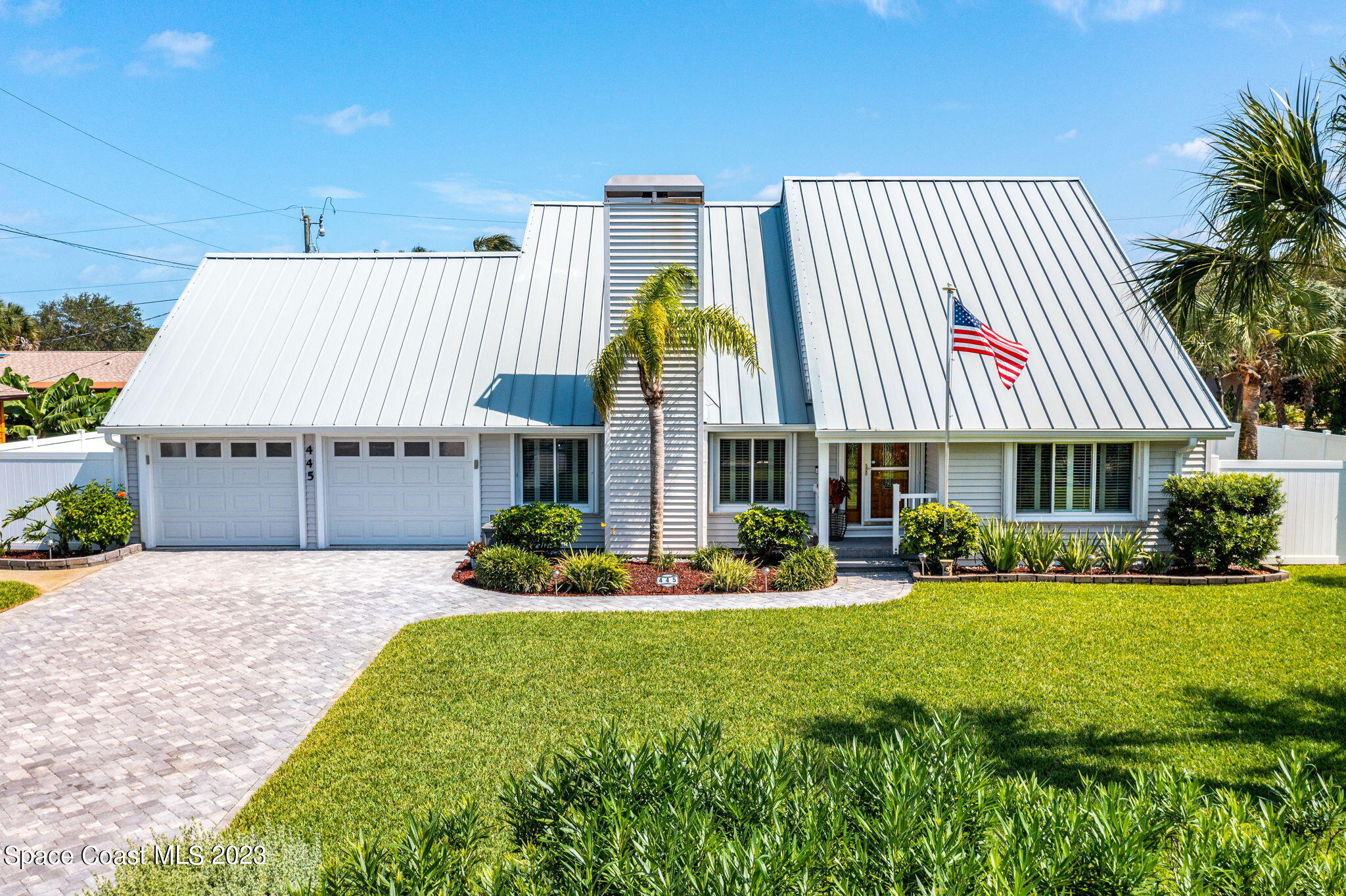 445 9th Avenue Indialantic, FL 32903 - Photo 53 of 62 a front view of a house with garden
