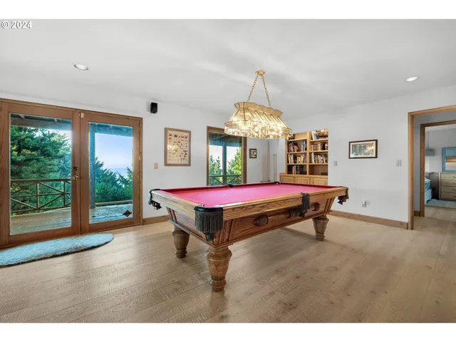 a dining room with furniture window outside view and wooden floor