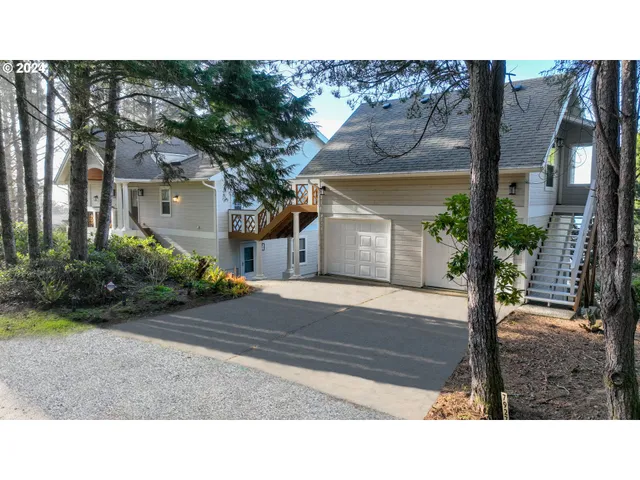 a kitchen with stainless steel appliances kitchen island granite countertop a stove and a sink