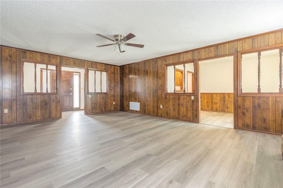 417 Greenmeadow Circle Anderson, SC 29626 - Photo 11 of 41 This versatile space features inviting wood paneling and sleek flooring, ready for your personal touch. Views of dining room and front entry.