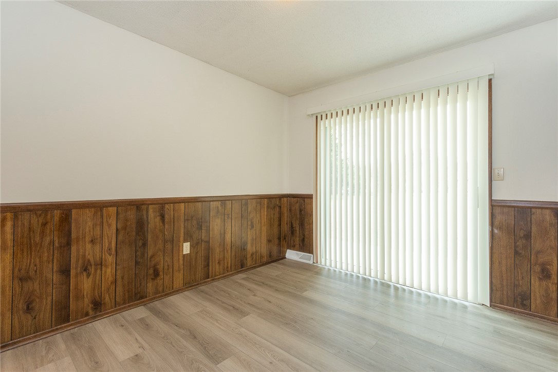 417 Greenmeadow Circle Anderson, SC 29626 - Photo 12 of 41 The dining room features wood paneling and offers abundant natural light with sliding doors out to the new 10x20 patio.