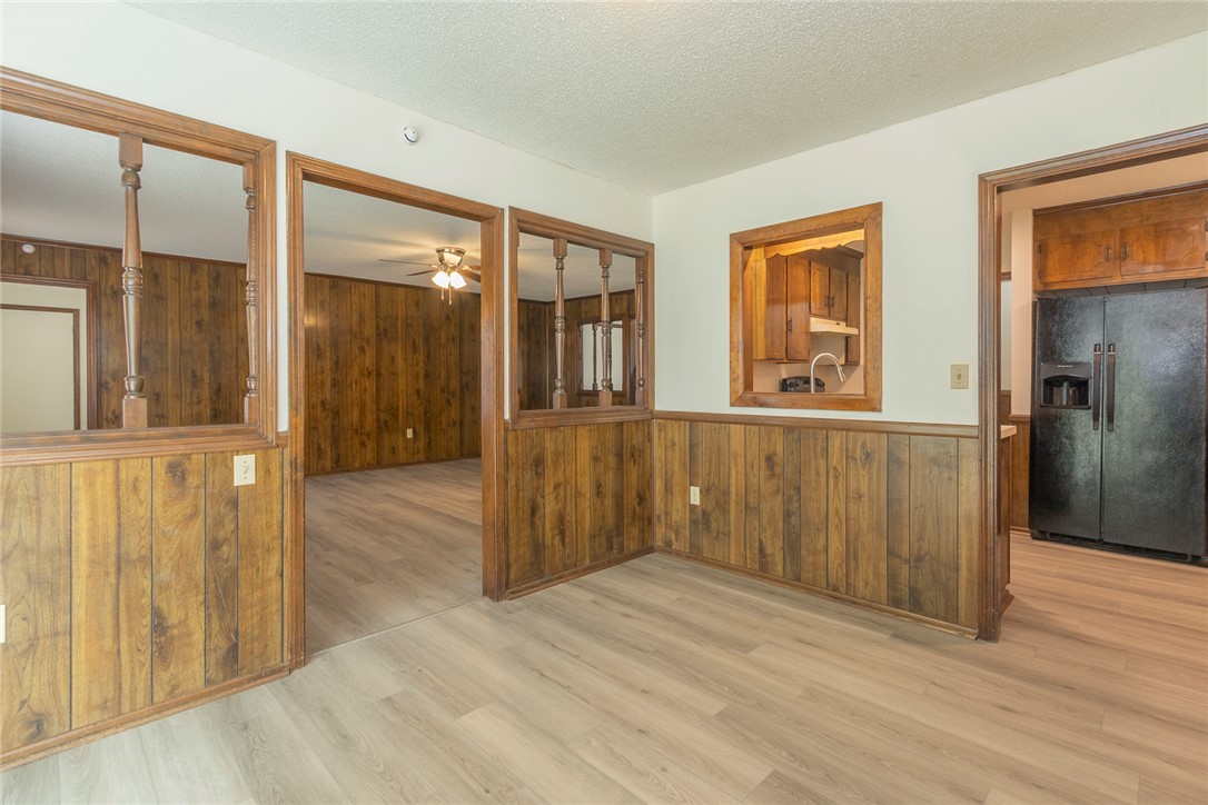 417 Greenmeadow Circle Anderson, SC 29626 - Photo 13 of 41 This inviting interior space features warm wood paneling and sleek flooring, offering a comfortable atmosphere.
