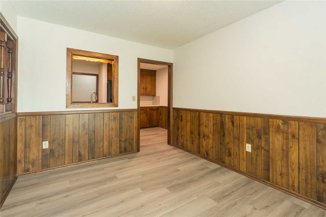417 Greenmeadow Circle Anderson, SC 29626 - Photo 14 of 41 This versatile room features warm wood paneling and durable new LVP flooring.