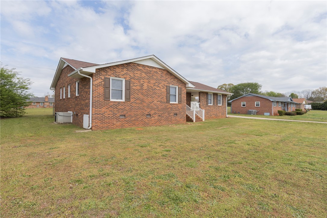 417 Greenmeadow Circle Anderson, SC 29626 - Photo 3 of 41 This classic brick residence with a neatly manicured lawn offers a welcoming exterior.
