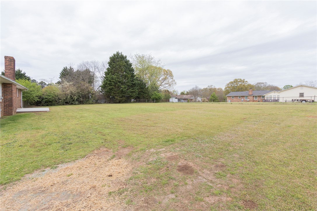 417 Greenmeadow Circle Anderson, SC 29626 - Photo 35 of 41 Expansive yard with fence and new 10x20 patio, offering potential for outdoor living and entertainment.
