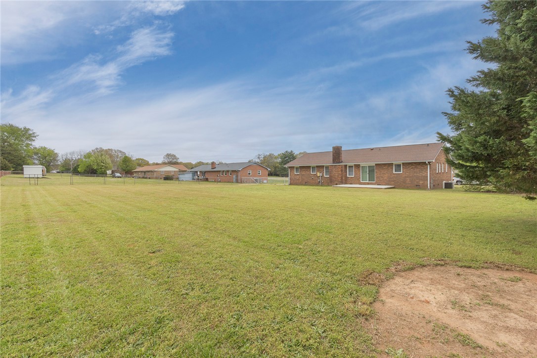 417 Greenmeadow Circle Anderson, SC 29626 - Photo 37 of 41 Expansive green backyard provides ample space for recreation and outdoor living.