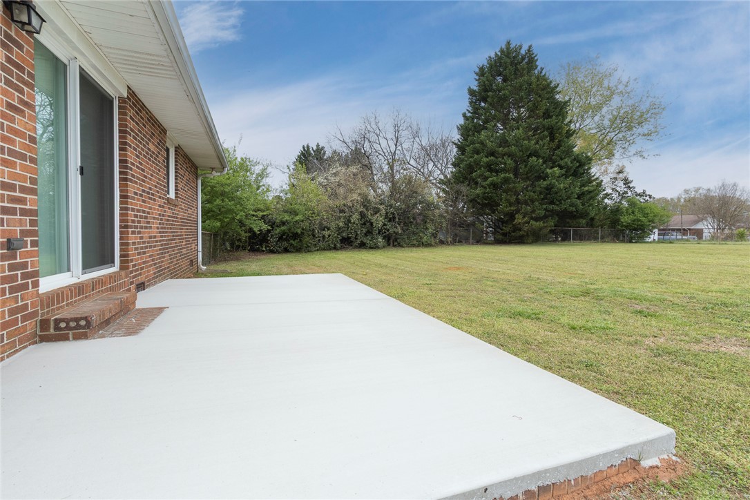 417 Greenmeadow Circle Anderson, SC 29626 - Photo 40 of 41 This spacious backyard with a large patio offers ample outdoor living potential.
